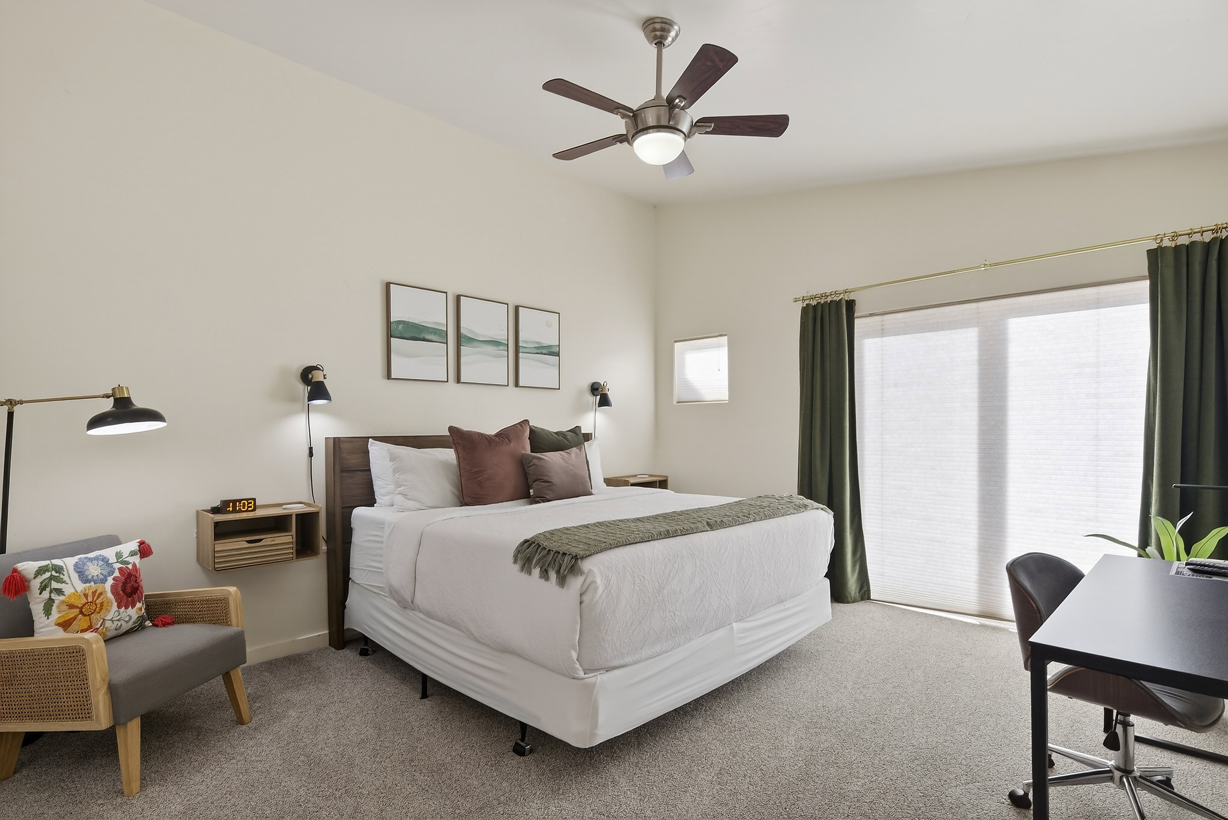Recessed ceiling fan, carpet flooring, dual wall-mounted sconces, and a wood-finish headboard