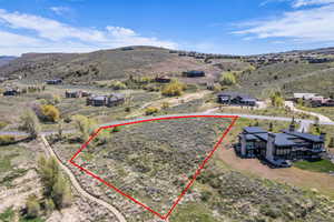 Expansive sloped lot with natural terrain