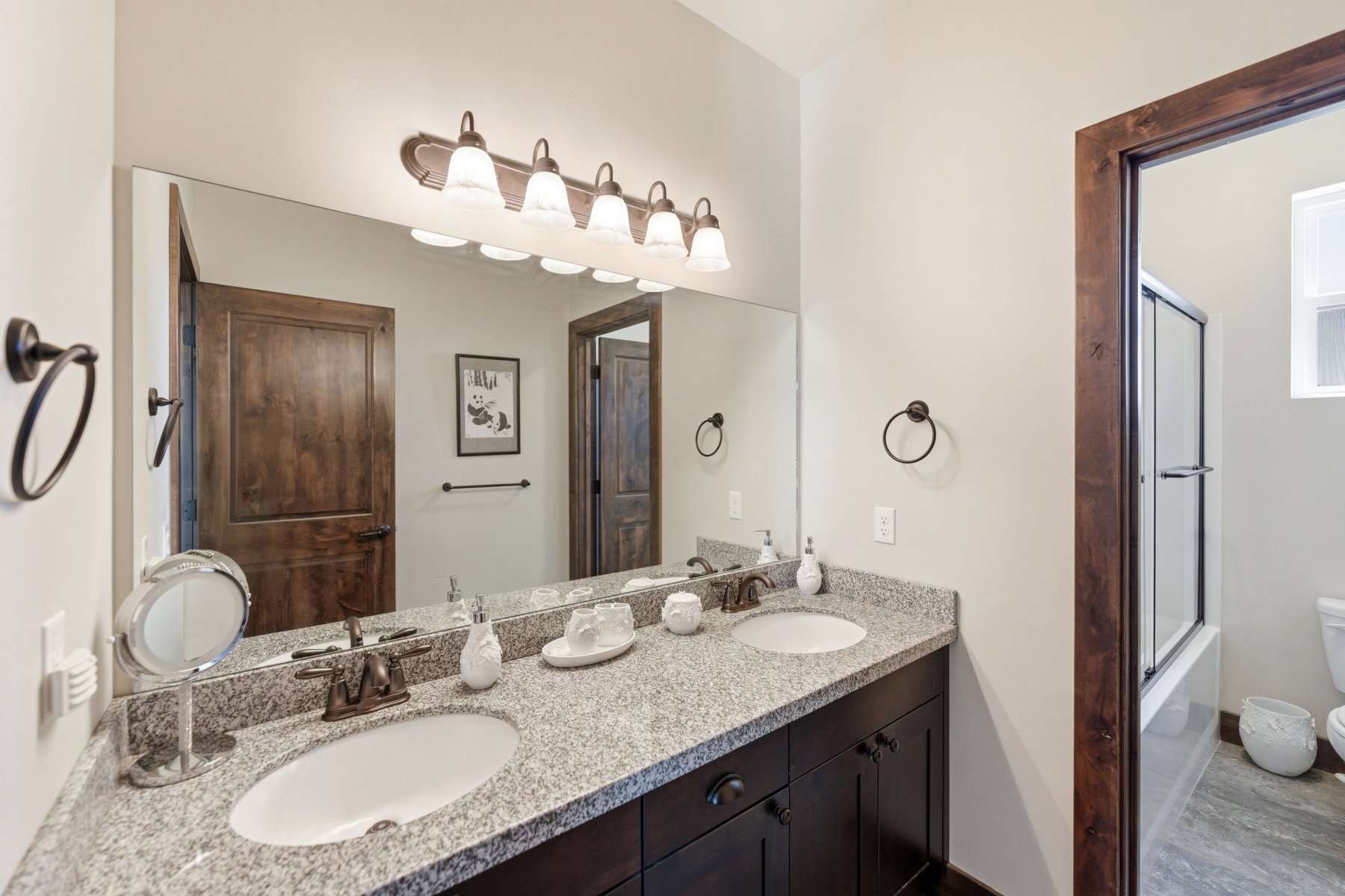 Dual vanity with granite countertop and undermount sinks