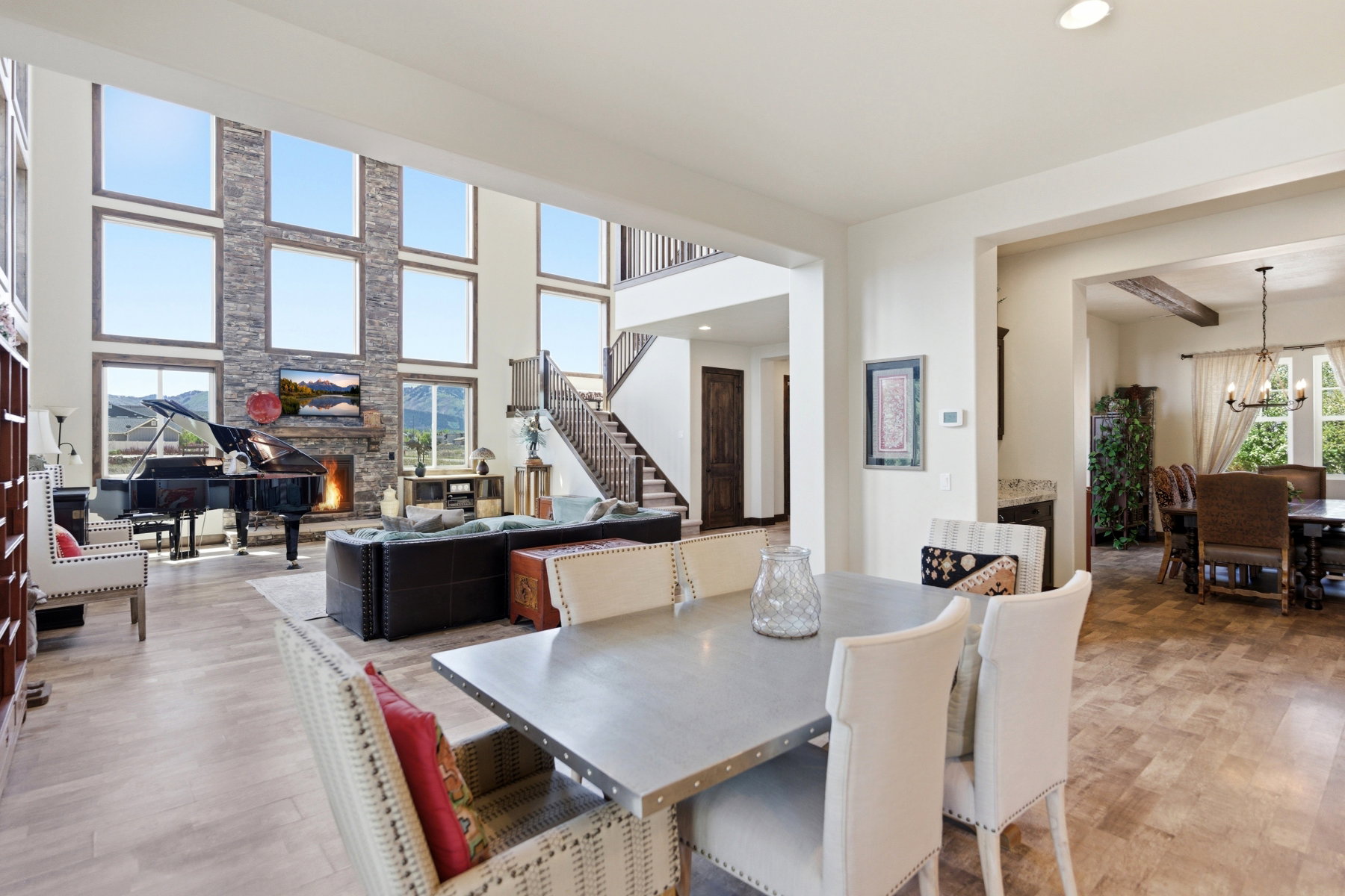 Vaulted ceilings with expansive window array and stone fireplace