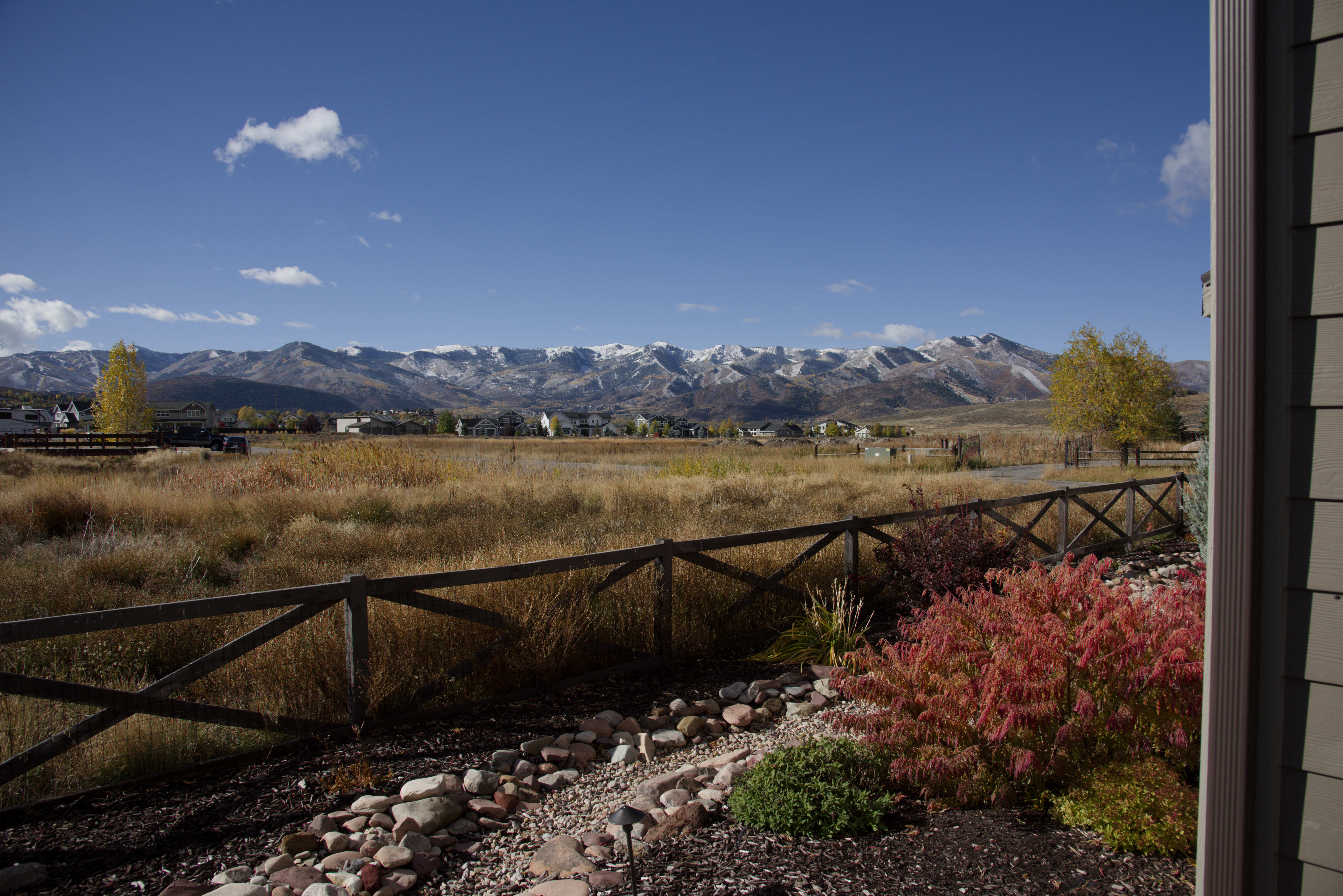 Mountain backdrop featuring snow-capped peaks and expansive natural landscaping