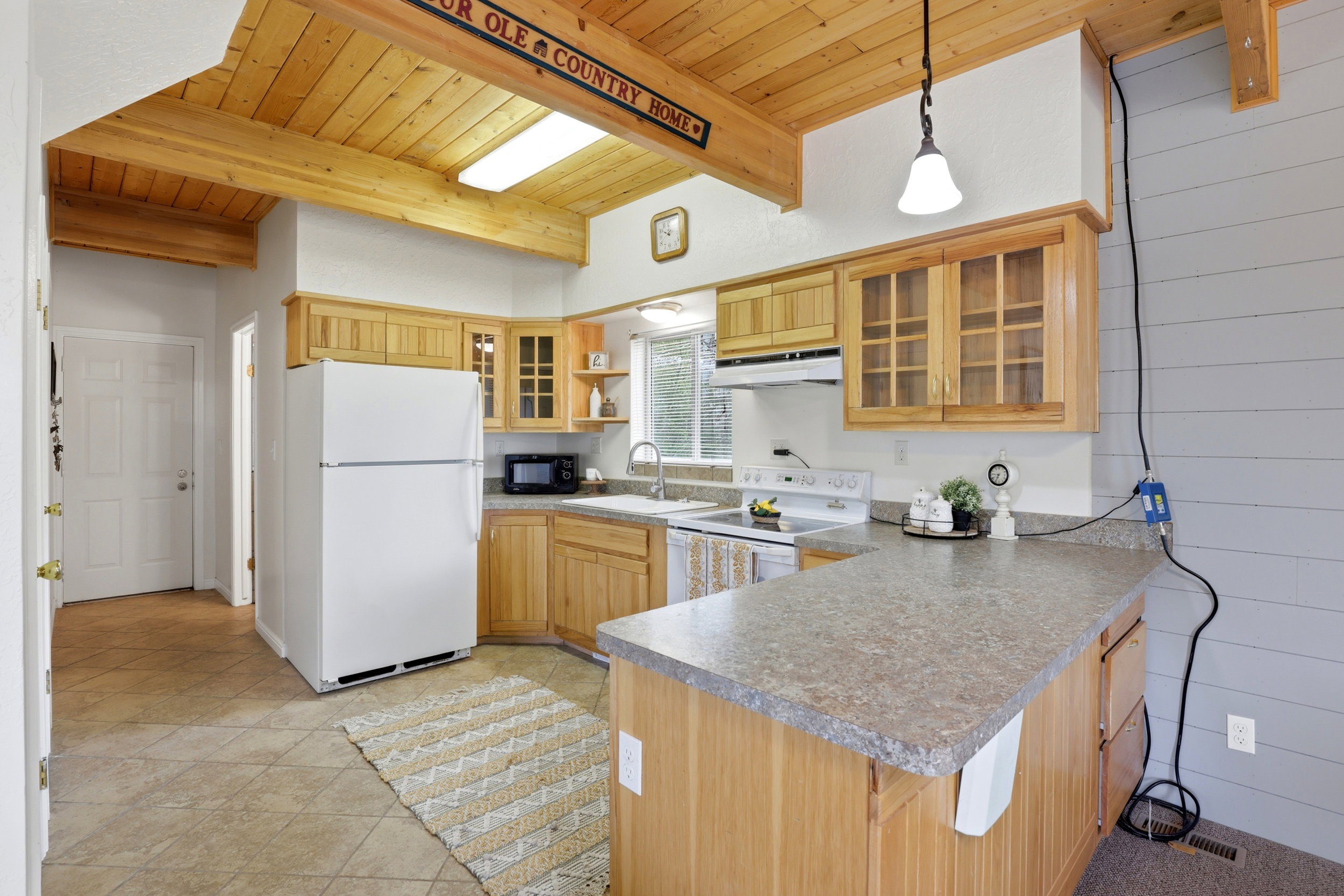 Kitchen featuring a wood-finish vaulted ceiling with exposed beams and recessed lighting