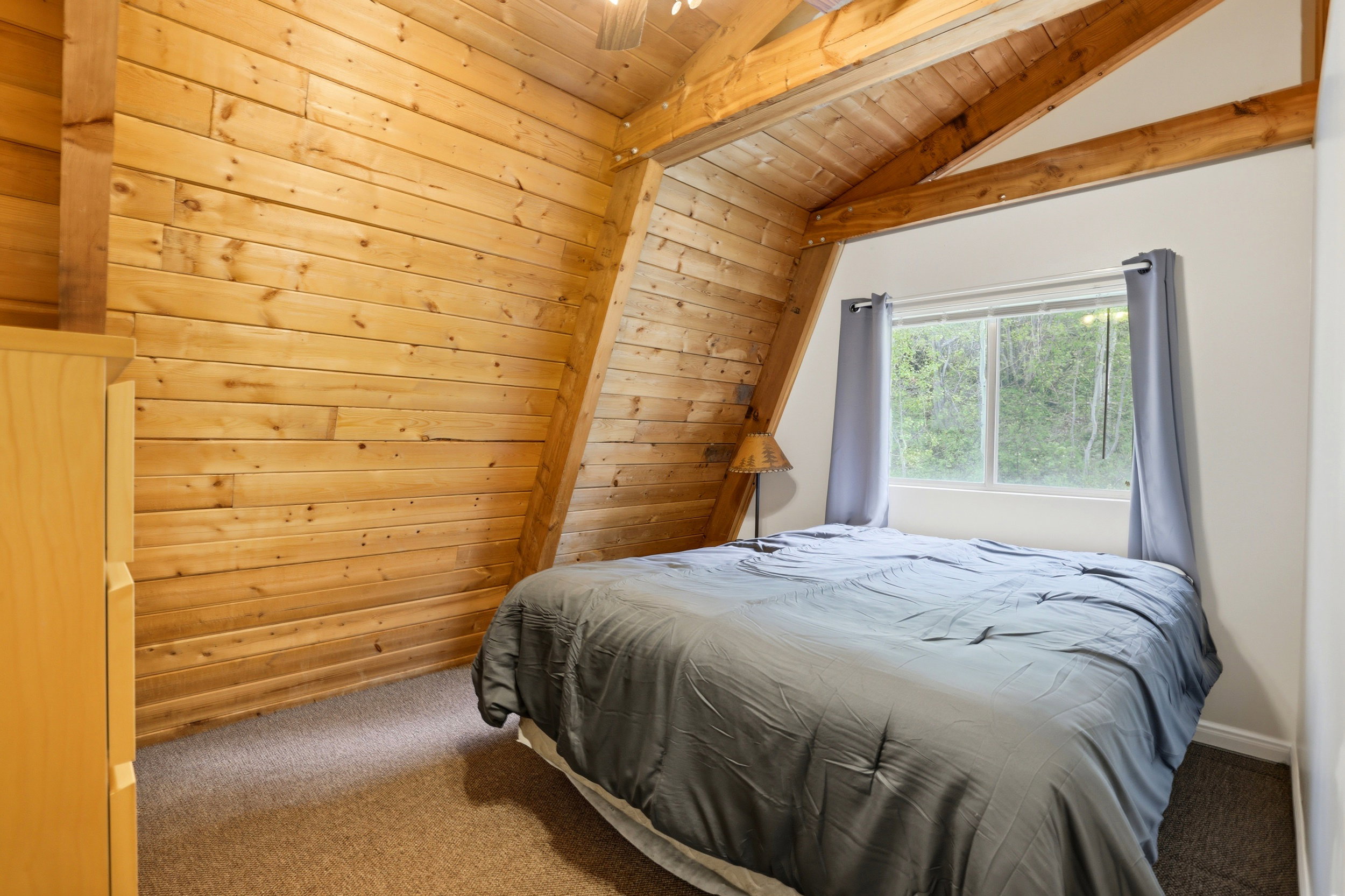 Vaulted wood-paneled ceiling with exposed beams