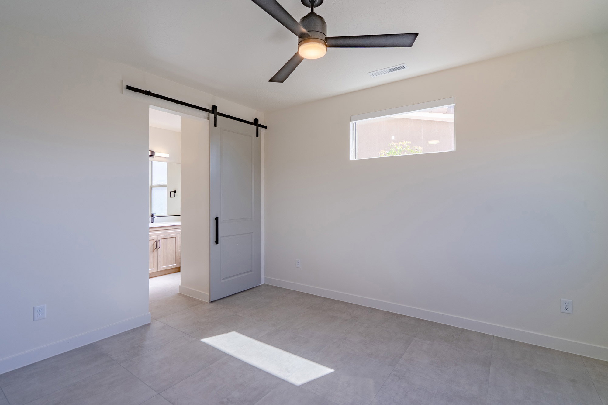 Neutral-toned tile flooring throughout