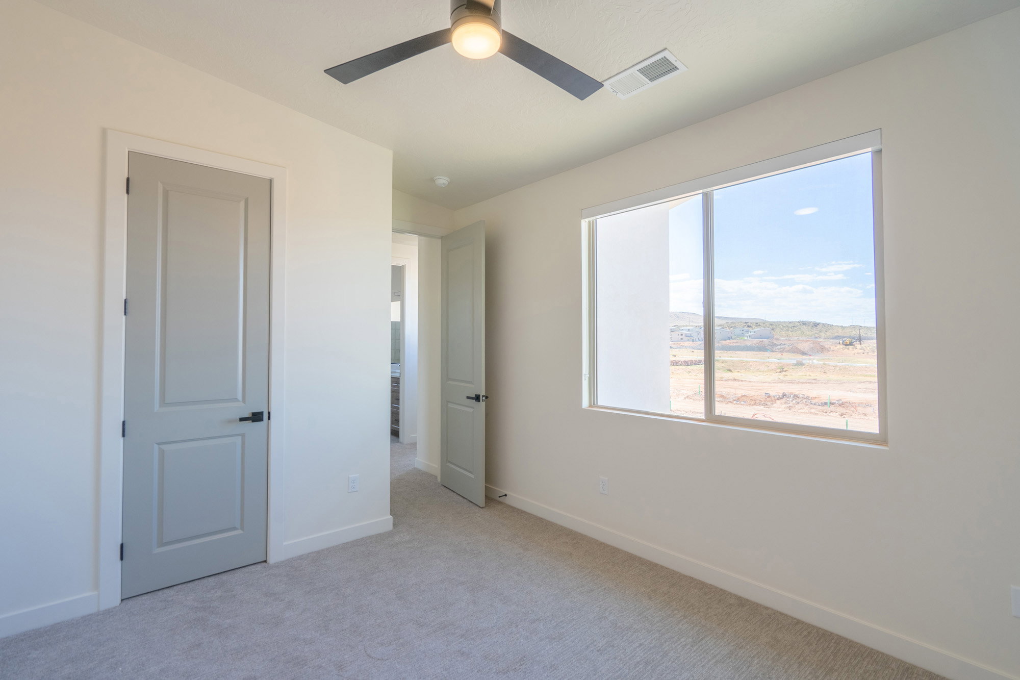 Neutral wall paint with light-colored carpeting