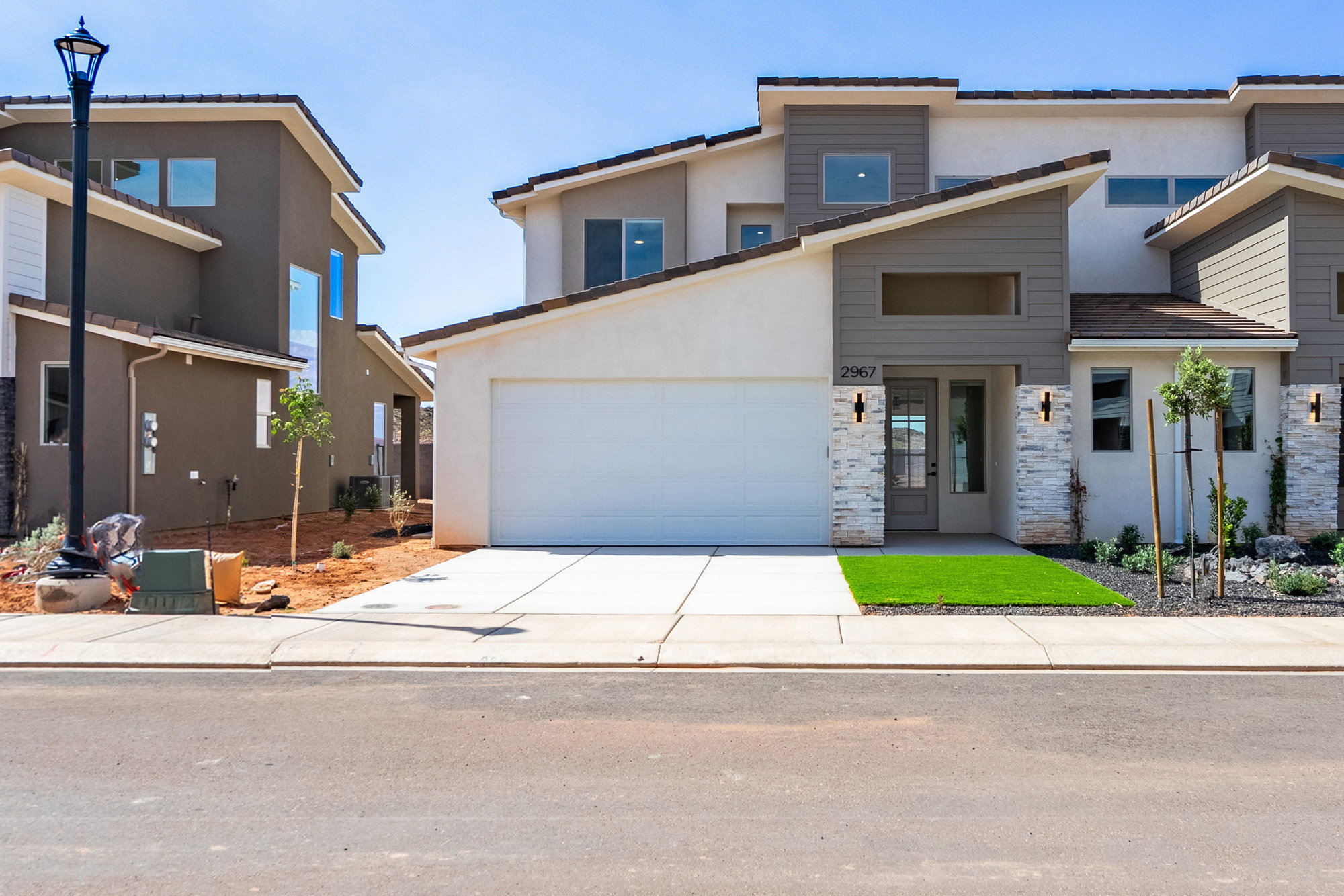 Contemporary multi-level exterior featuring a combination of stucco and horizontal siding