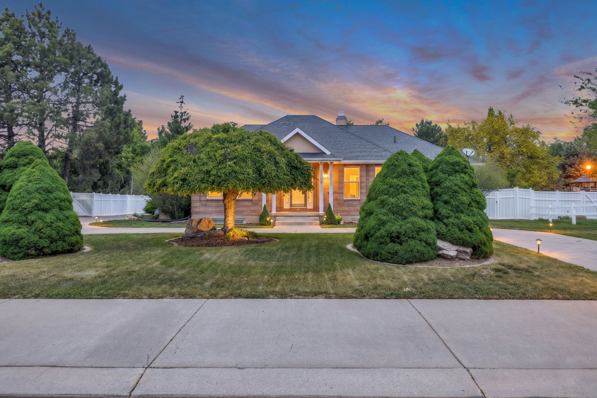 Ranch-style residence featuring a prominent front entrance and a dark-toned roof