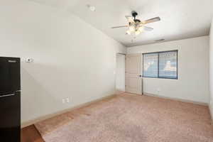 ADU living room, neutral-toned carpeting extends across this room featuring a ceiling fan with integrated lighting