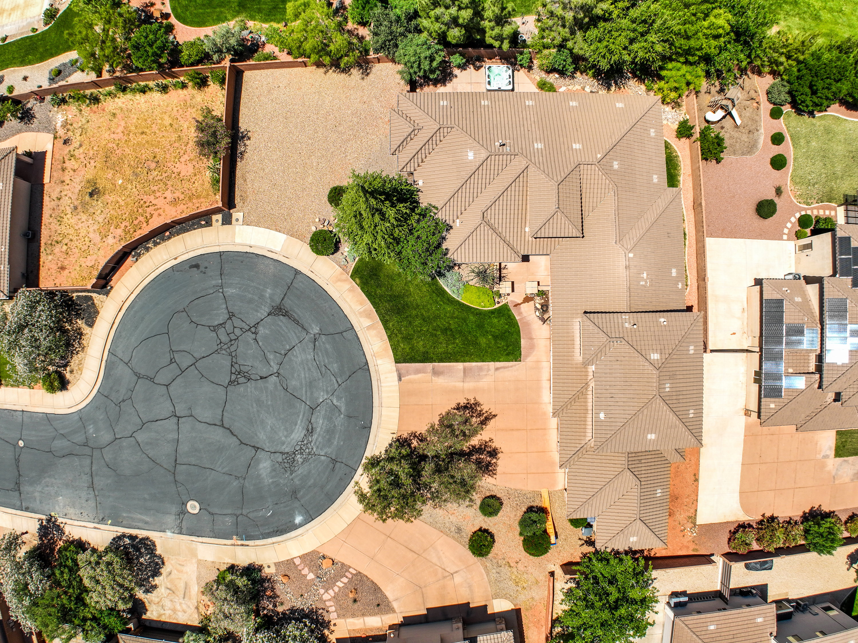 Aerial view showcasing a residential property with a multi-gabled roofline.