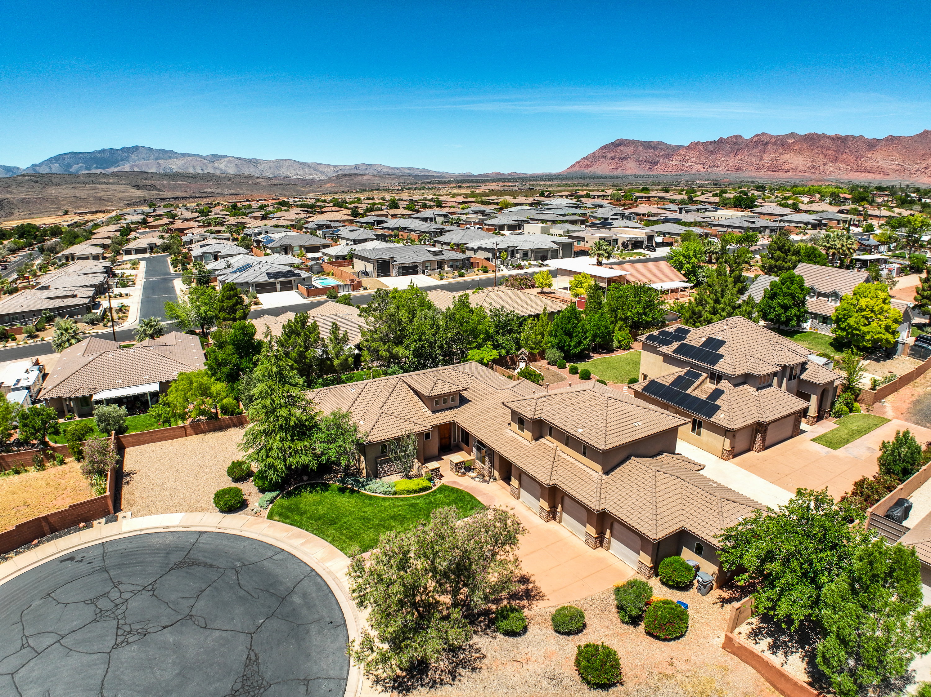 Aerial view of residential neighborhood with tiled roof.