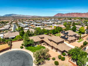 Aerial view of residential neighborhood with tiled roof.