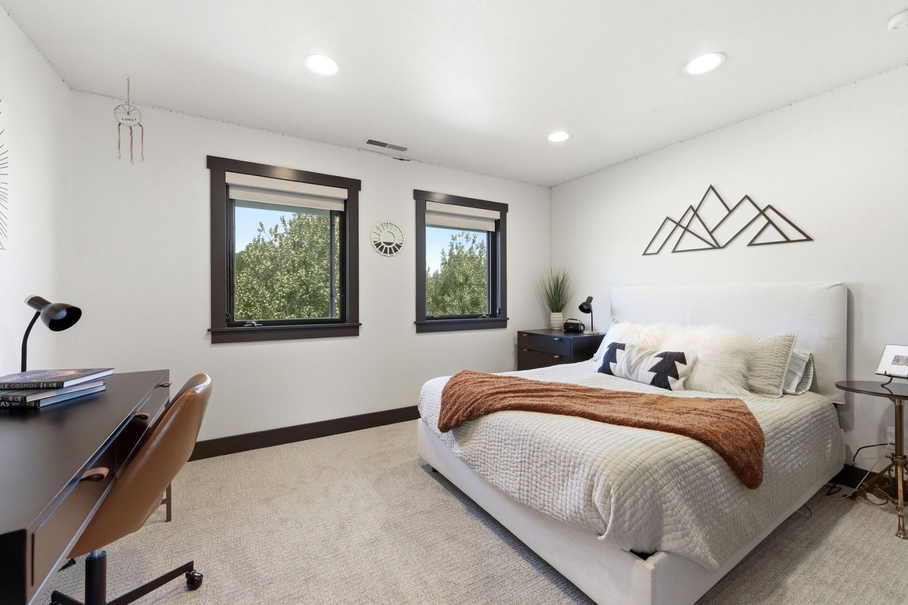 Bedroom featuring neutral carpeting and white walls