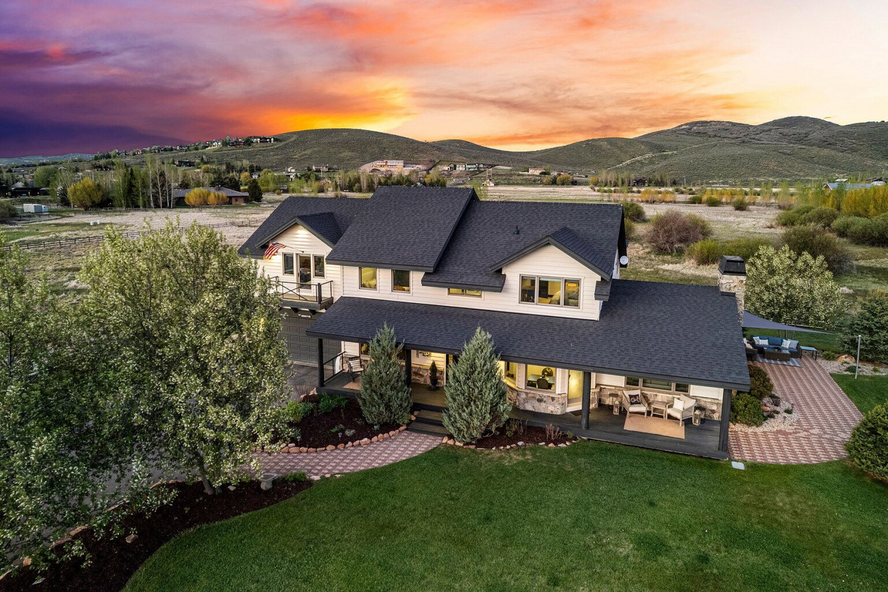 Spacious property with a large, manicured lawn and mature trees