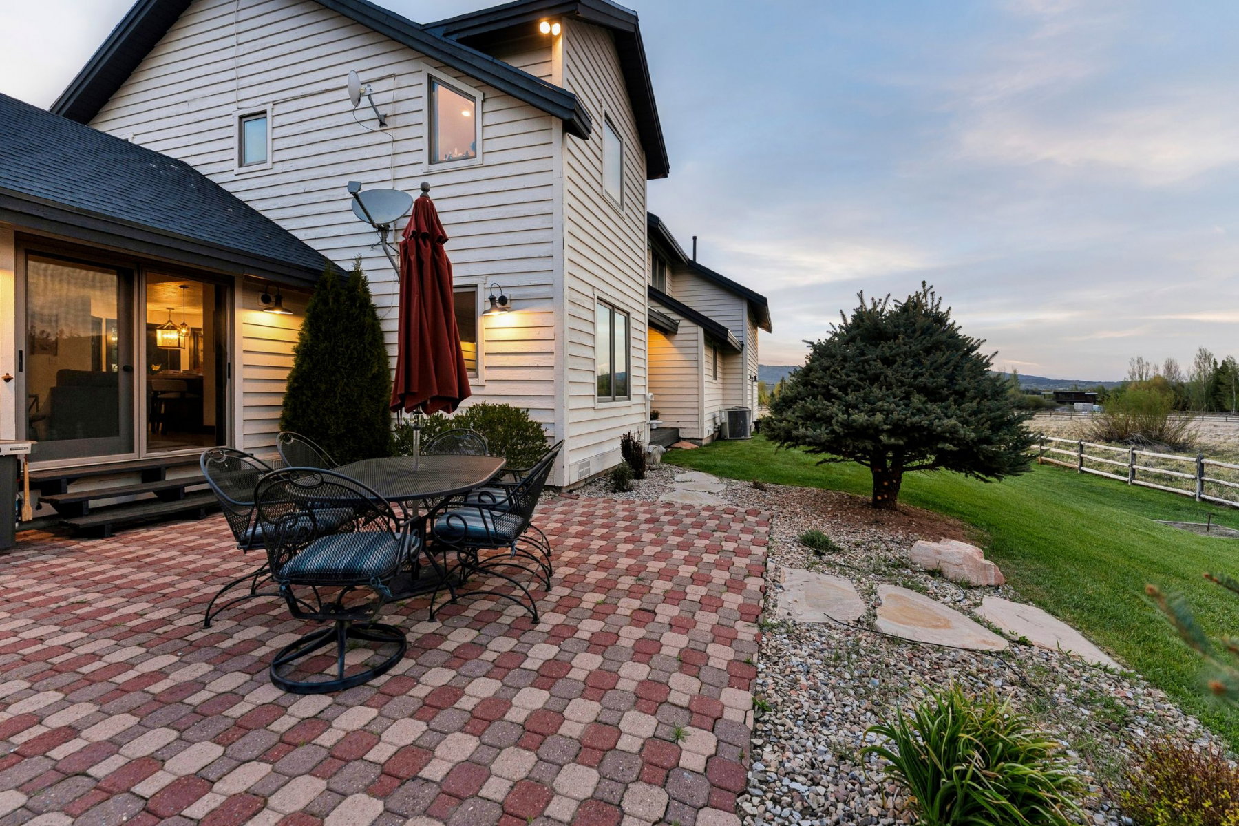 Multi-tone paver patio featuring direct access to interior spaces through sliding glass doors