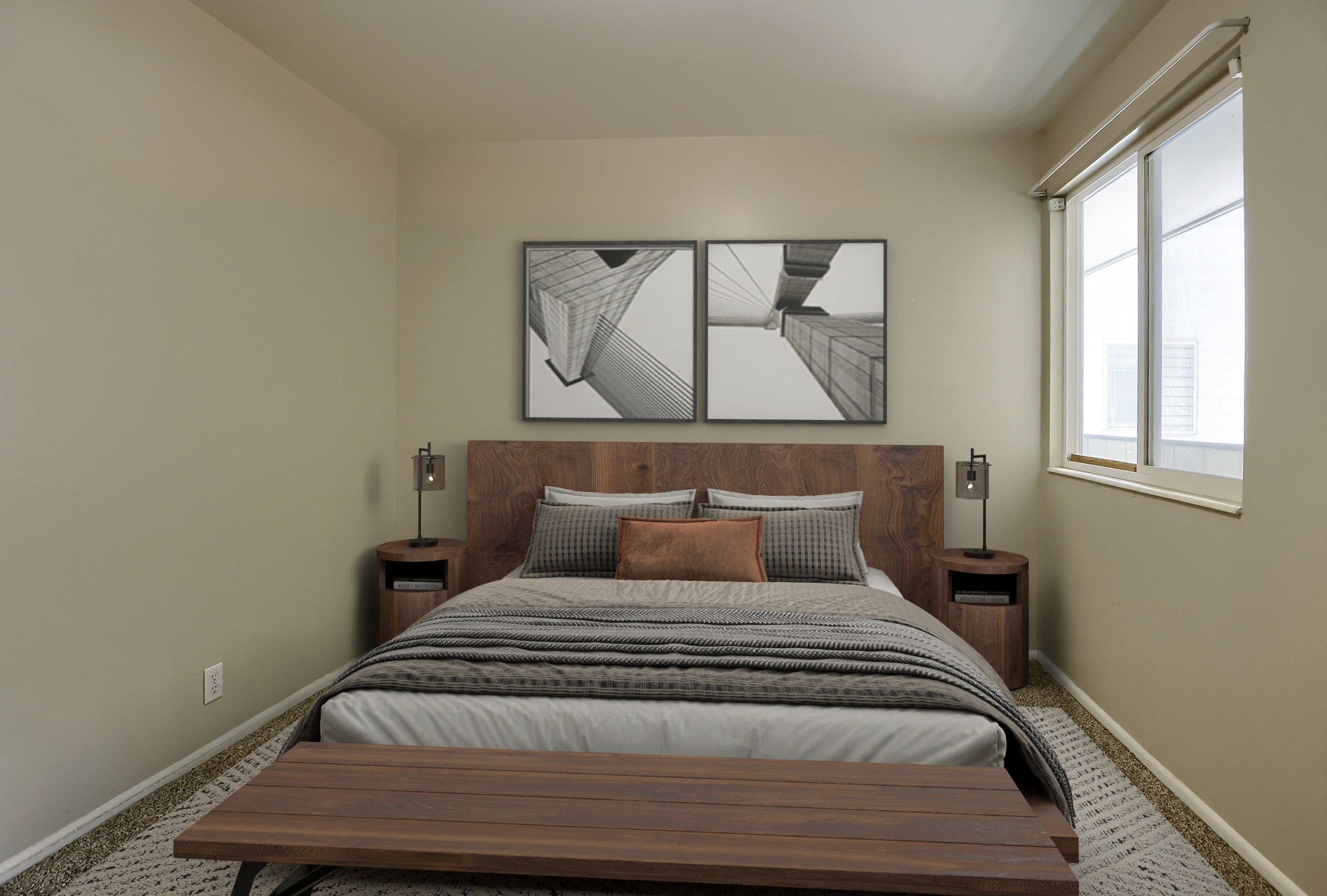 Bedroom featuring a large window, neutral wall tones, and textured carpeting