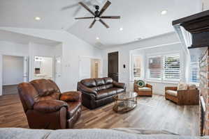 Custom built ADU/Living area featuring wood-finish flooring, vaulted ceilings, and recessed lighting