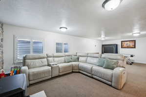 Spacious room featuring neutral carpeting and white walls