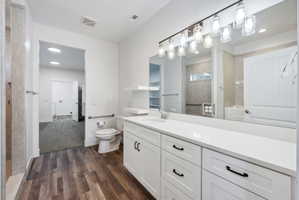 Custom built ADU/Spacious bathroom featuring a double vanity with white cabinetry and a light-colored countertop