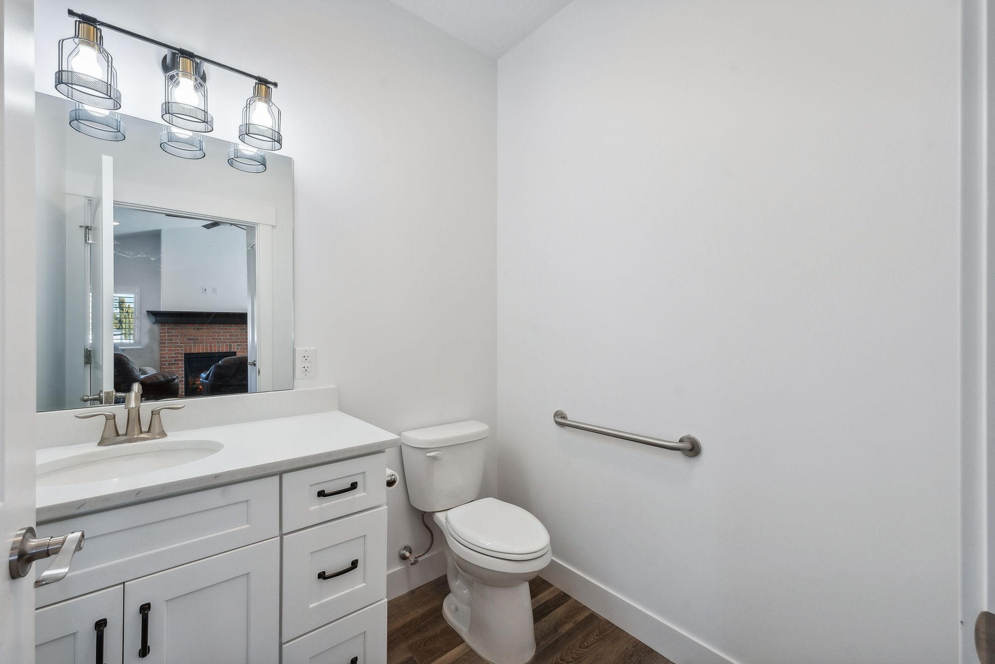 Custom built ADU/Bathroom featuring a single vanity with white cabinetry, a rectangular undermount sink, and a light-colored countertop