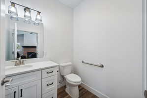 Custom built ADU/Bathroom featuring a single vanity with white cabinetry, a rectangular undermount sink, and a light-colored countertop