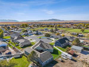 Aerial perspective showcasing a residential community with distant mountain scenery