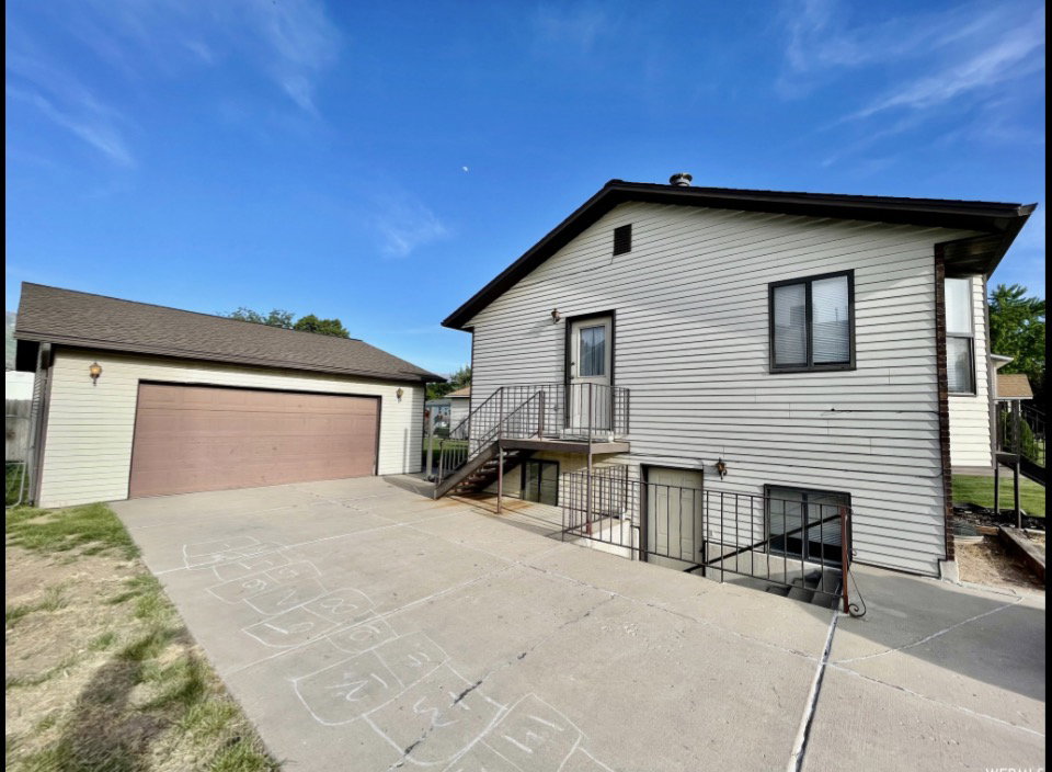 Detached garage with a brown garage door