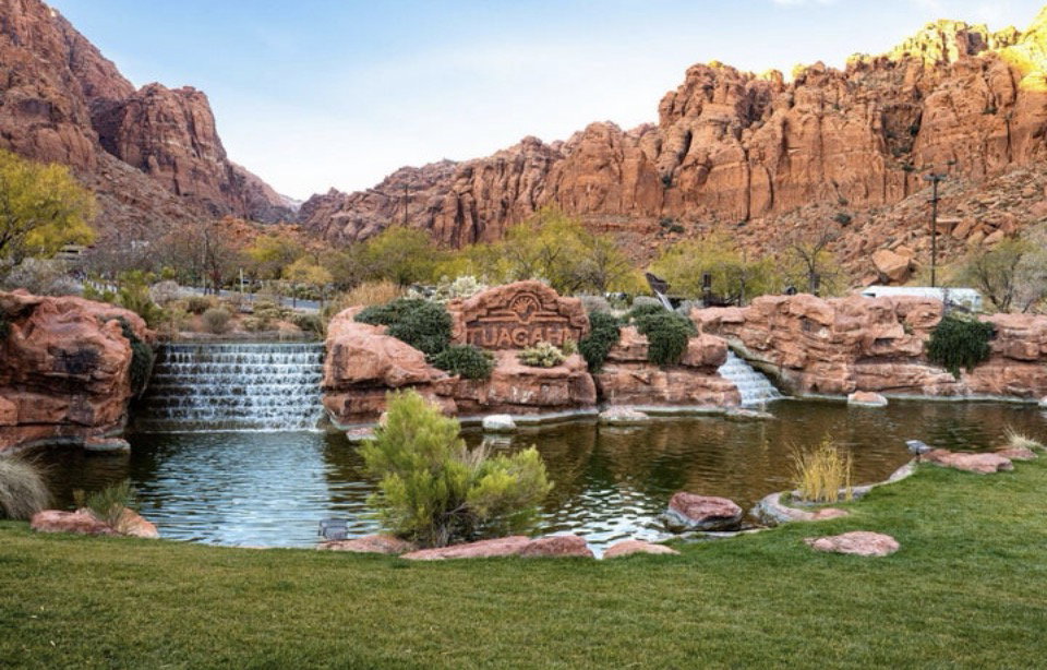 Water feature with tiered waterfalls and additional cascading water elements