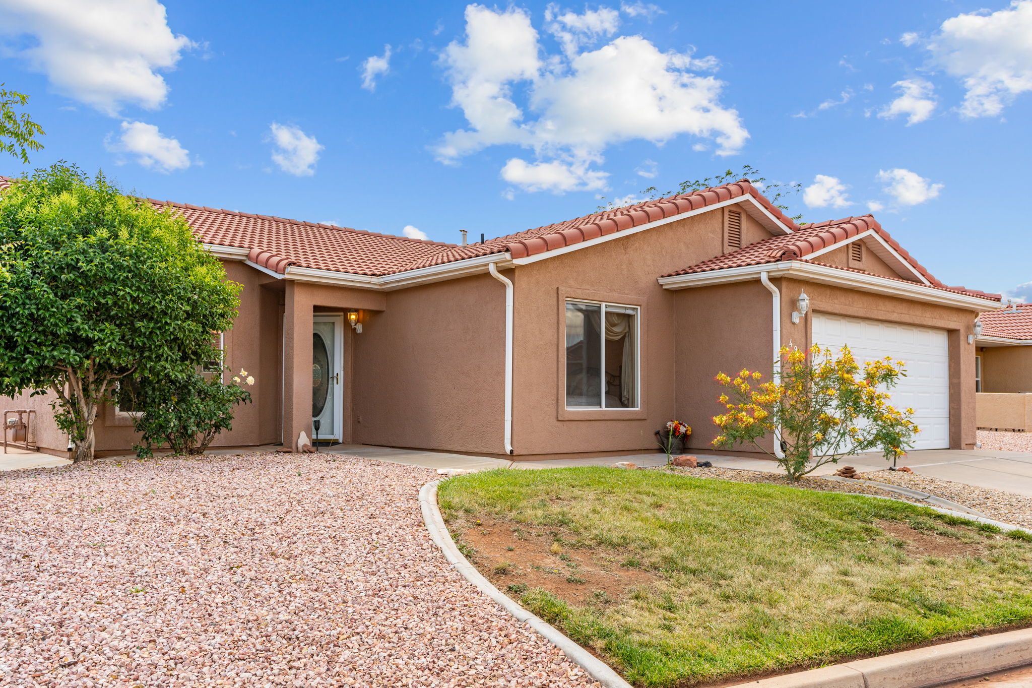 Southwestern-style stucco exterior with a terra cotta tile roof