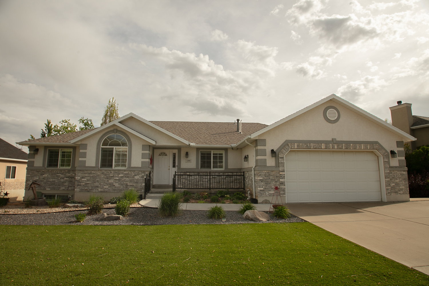 Stucco exterior with stone veneer accents