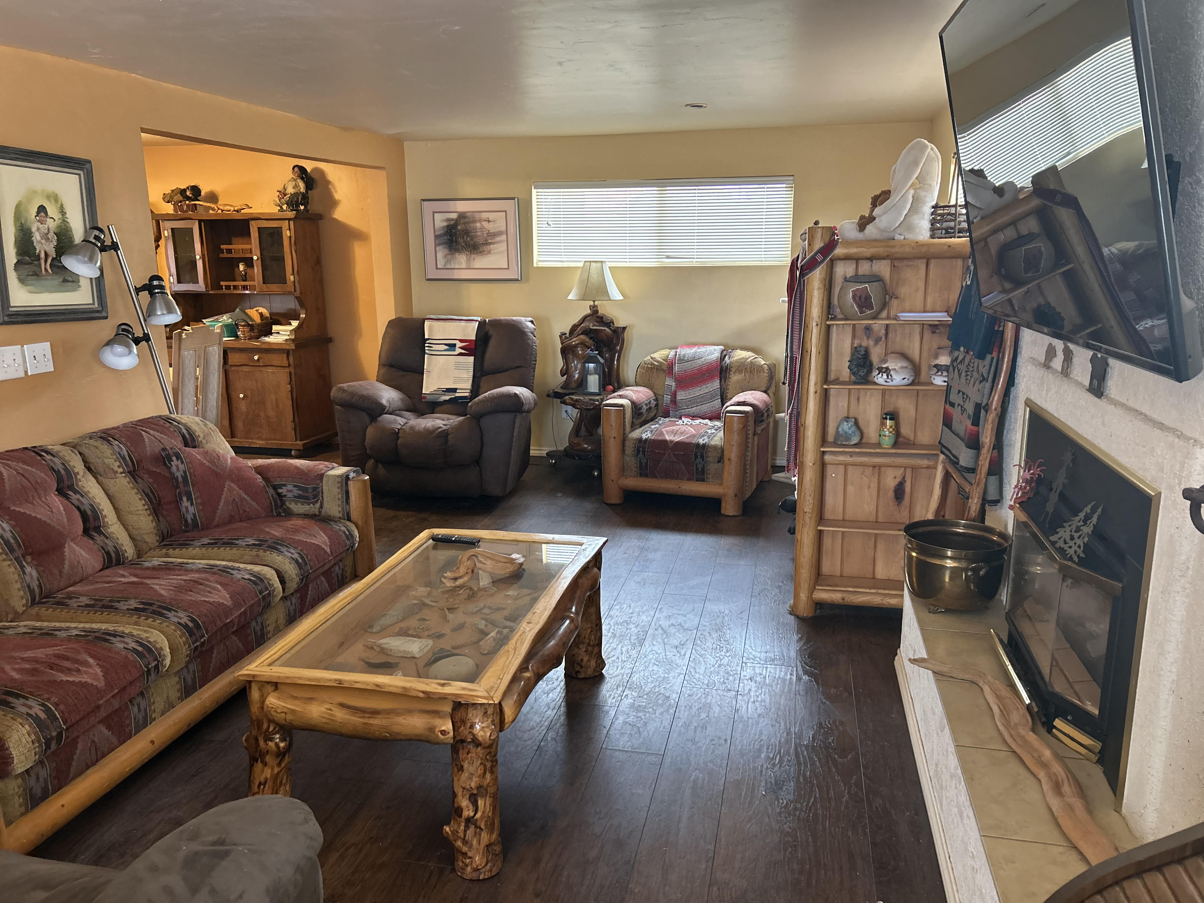 Den area with gas fireplace.