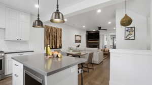 Modern kitchen island with a stone countertop and integrated storage
