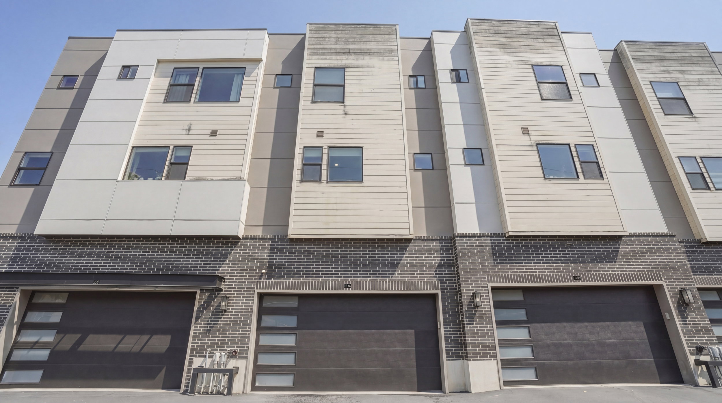 Contemporary townhome exterior featuring multi-level architecture