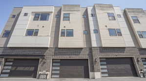 Contemporary townhome exterior featuring multi-level architecture