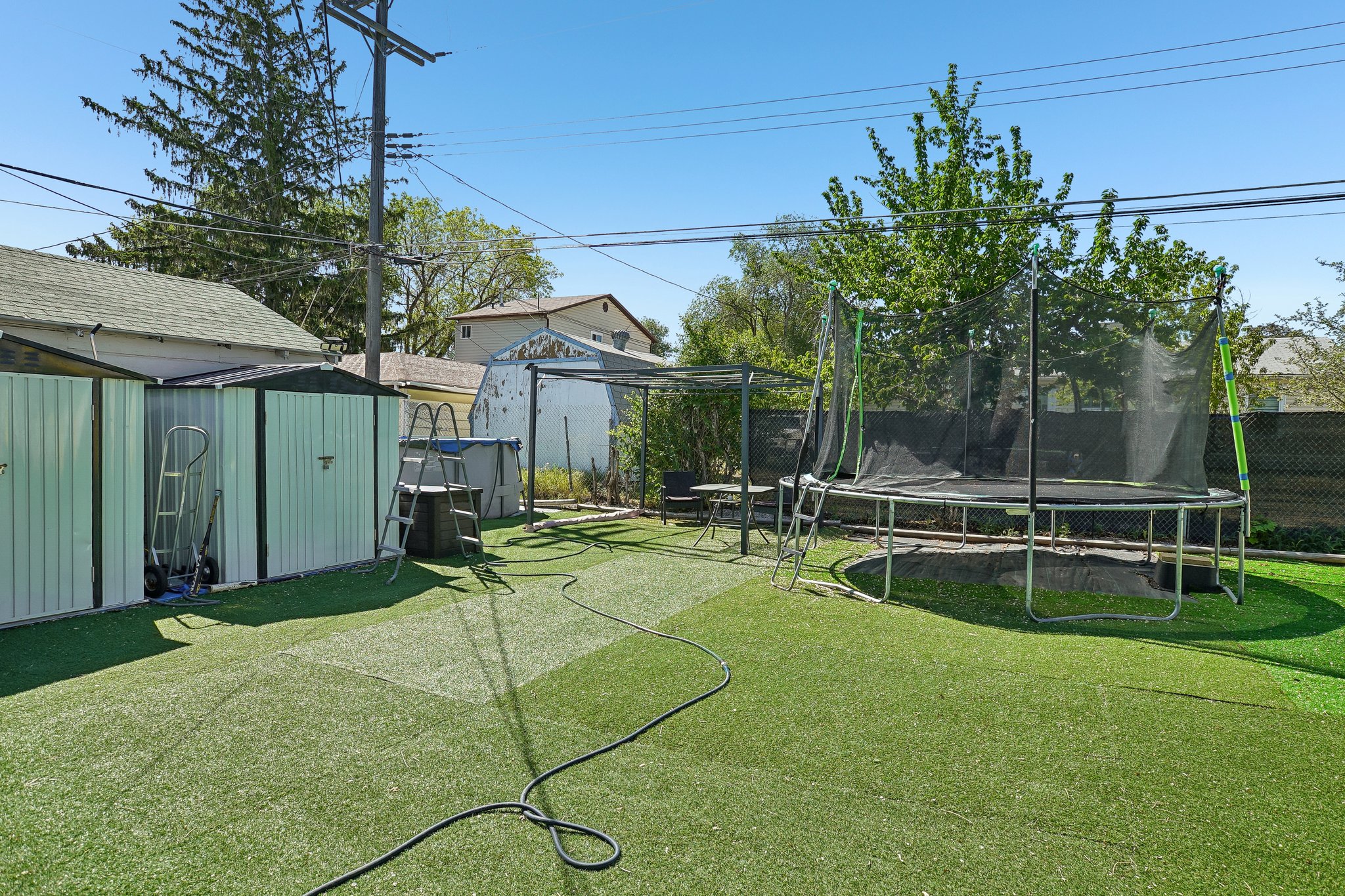 2 Storage Sheds & Trampoline