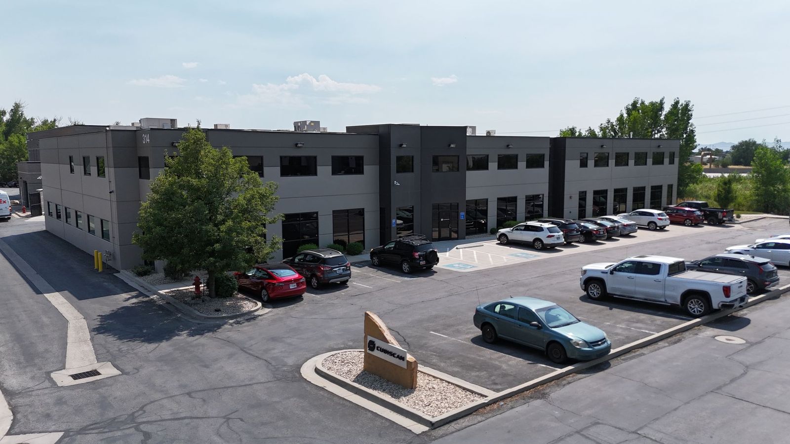 Modern commercial building featuring a gray and black facade