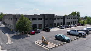 Modern commercial building featuring a gray and black facade