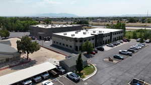 Contemporary commercial buildings with dark gray and lighter gray siding
