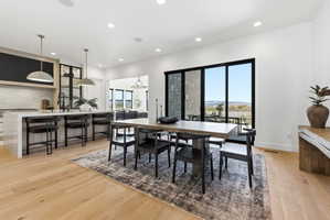 Open-concept living space with light wood-finish flooring