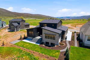 Contemporary architecture with stone and dark paneling accents