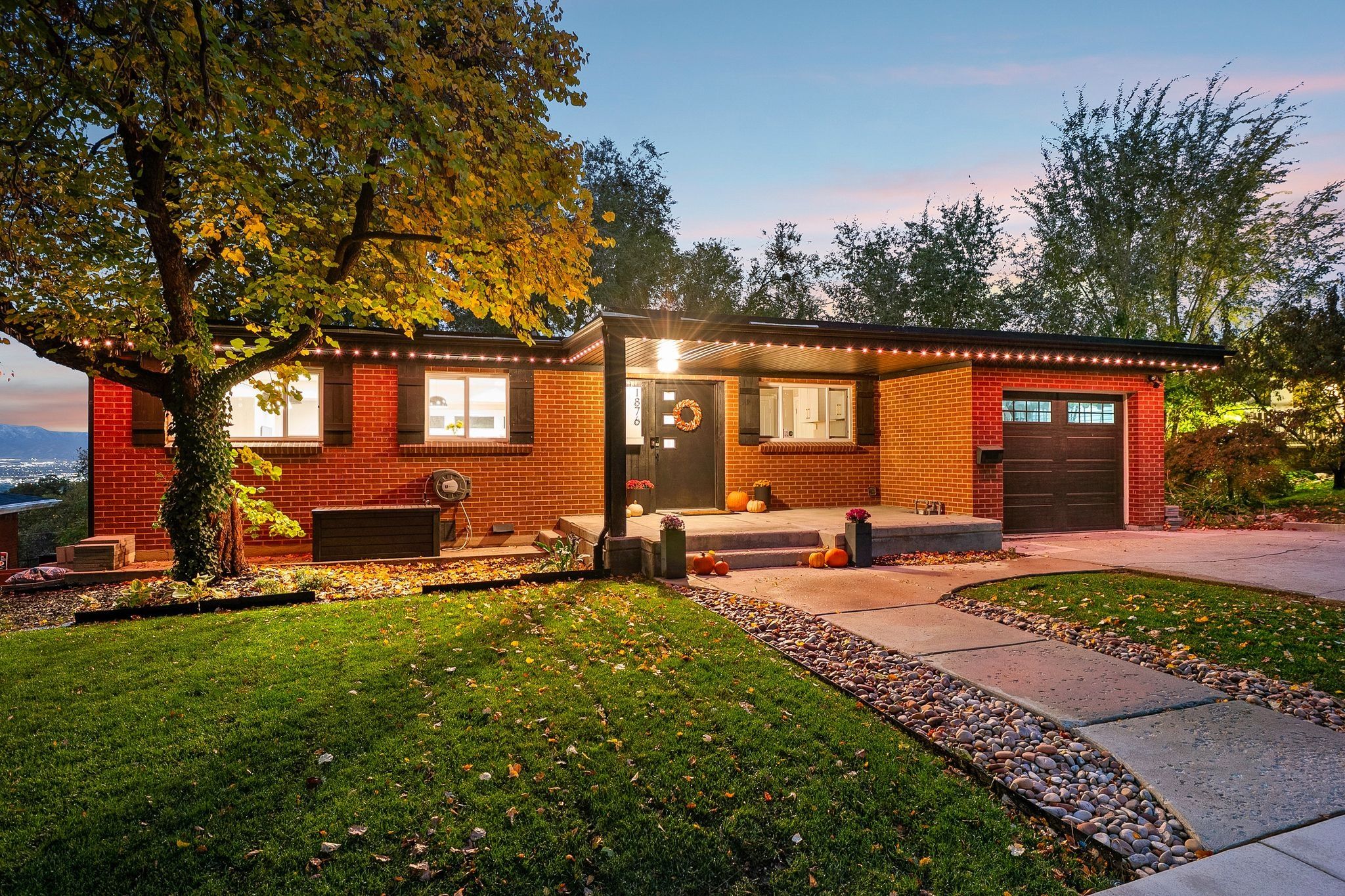 Red brick exterior featuring a covered entry porch