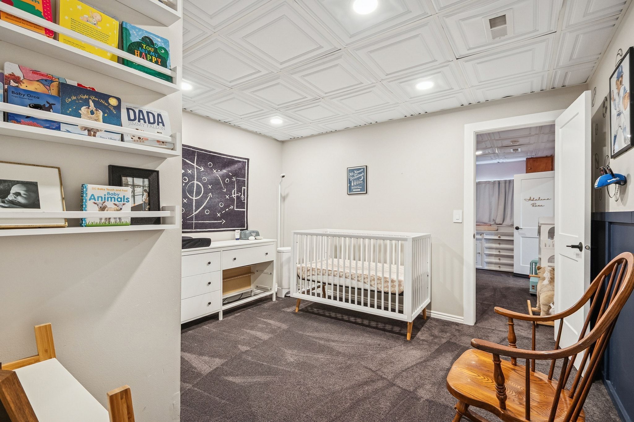 Recessed lighting illuminates a textured ceiling, providing brightness to the space
