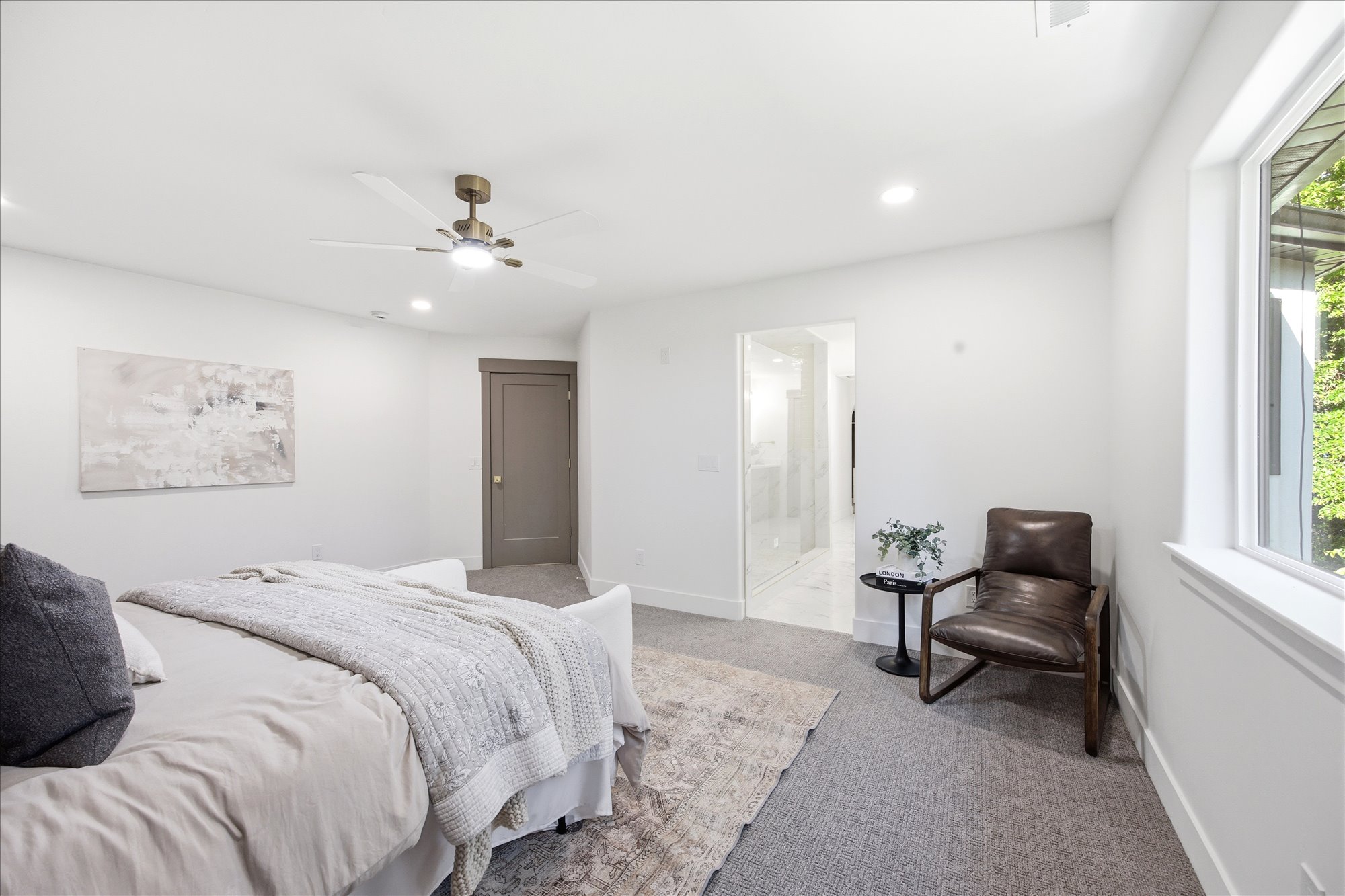 Carpeted bedroom featuring white walls, recessed lighting, and an overhead ceiling fan