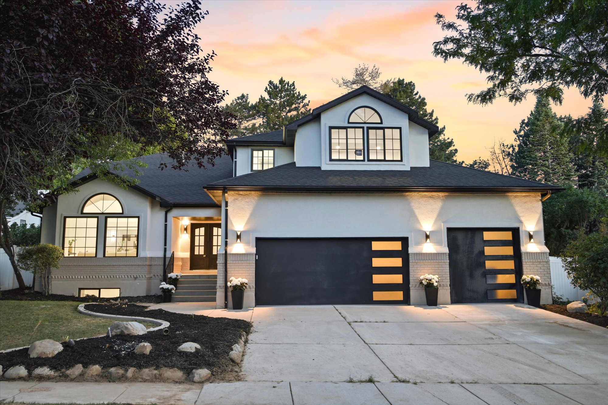 Contemporary exterior with smooth stucco and painted brick accents