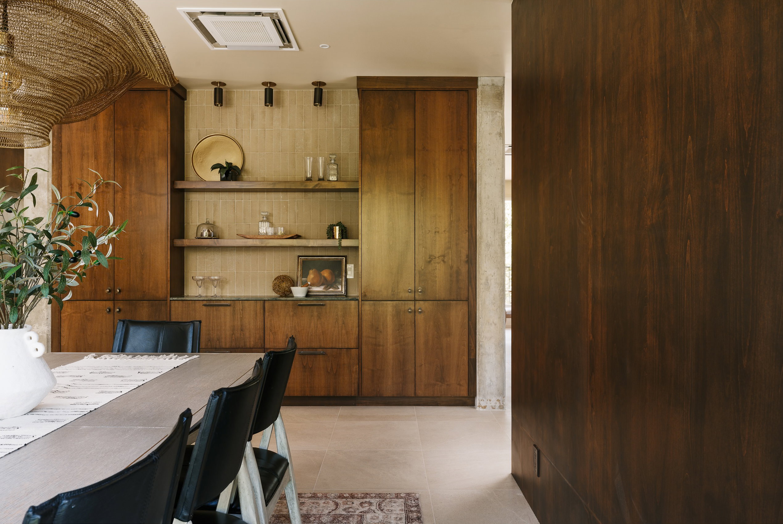 Built-in wood cabinetry with integrated storage and open shelving
