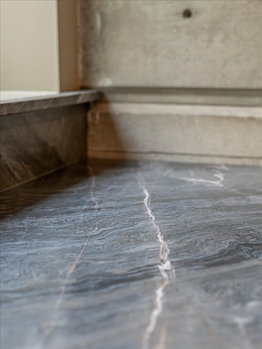Polished stone surface with pronounced veining
