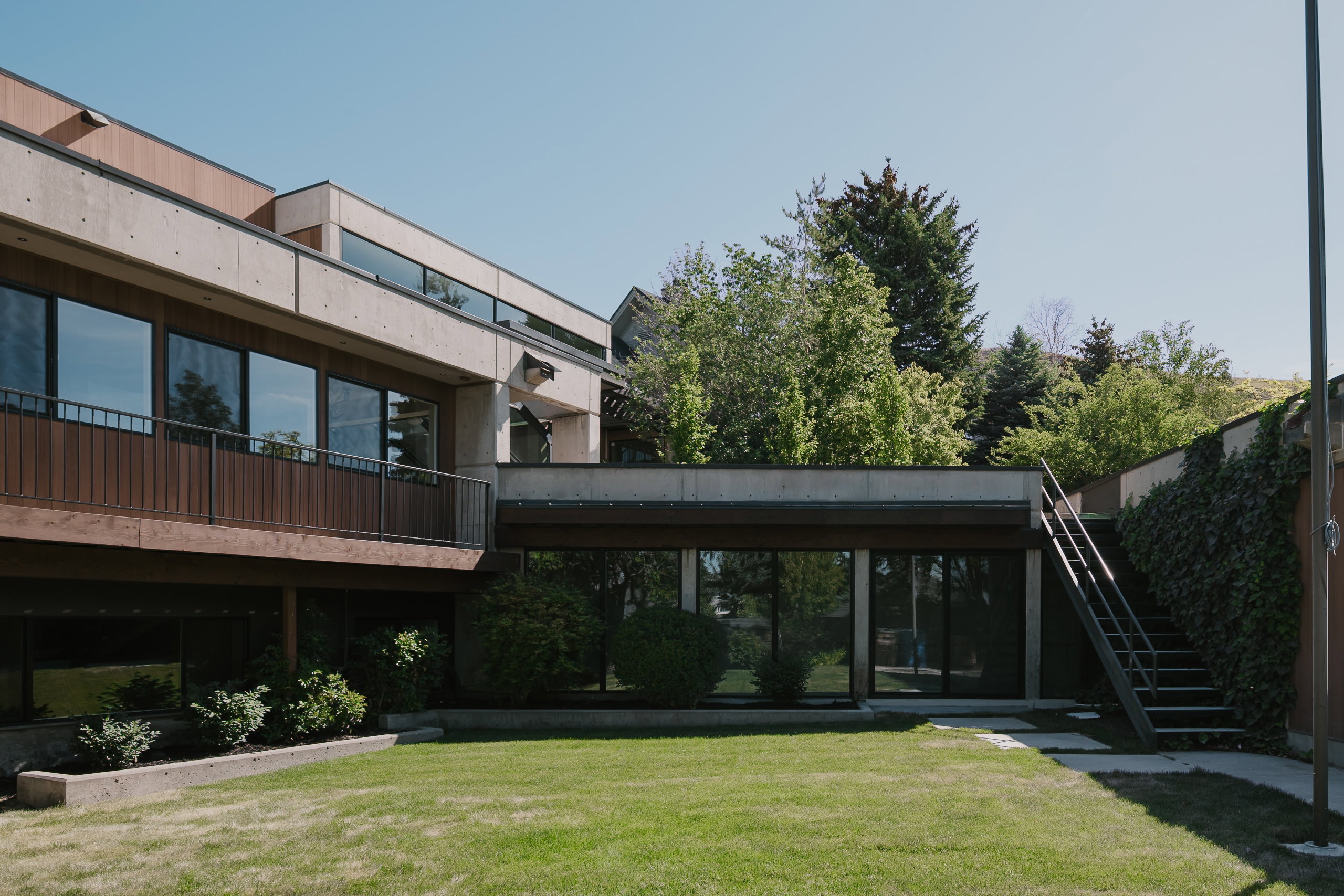 Modern architecture featuring concrete and wood-finish siding