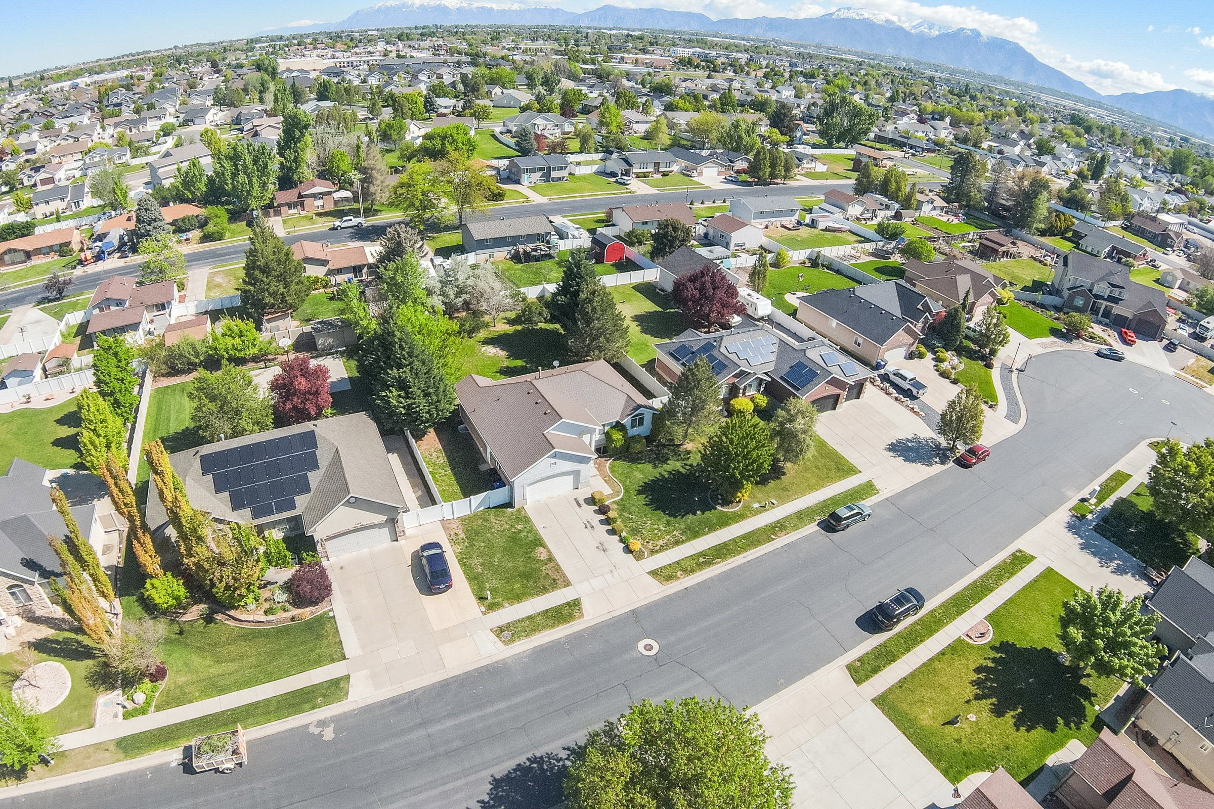 Residential neighborhood featuring an array of single-family homes with pitched roofs and attached garages