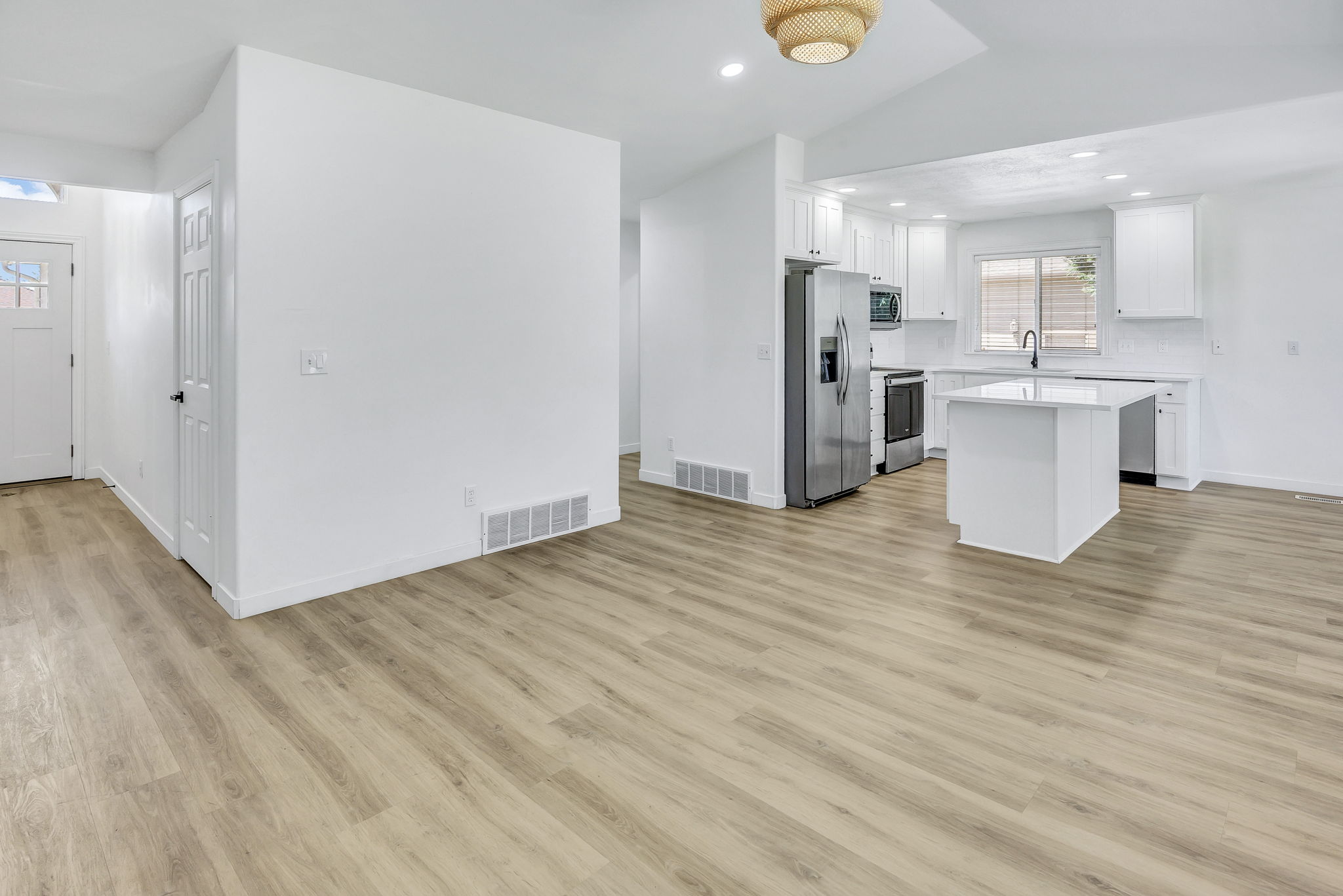 Spacious interior featuring wood-finish flooring throughout