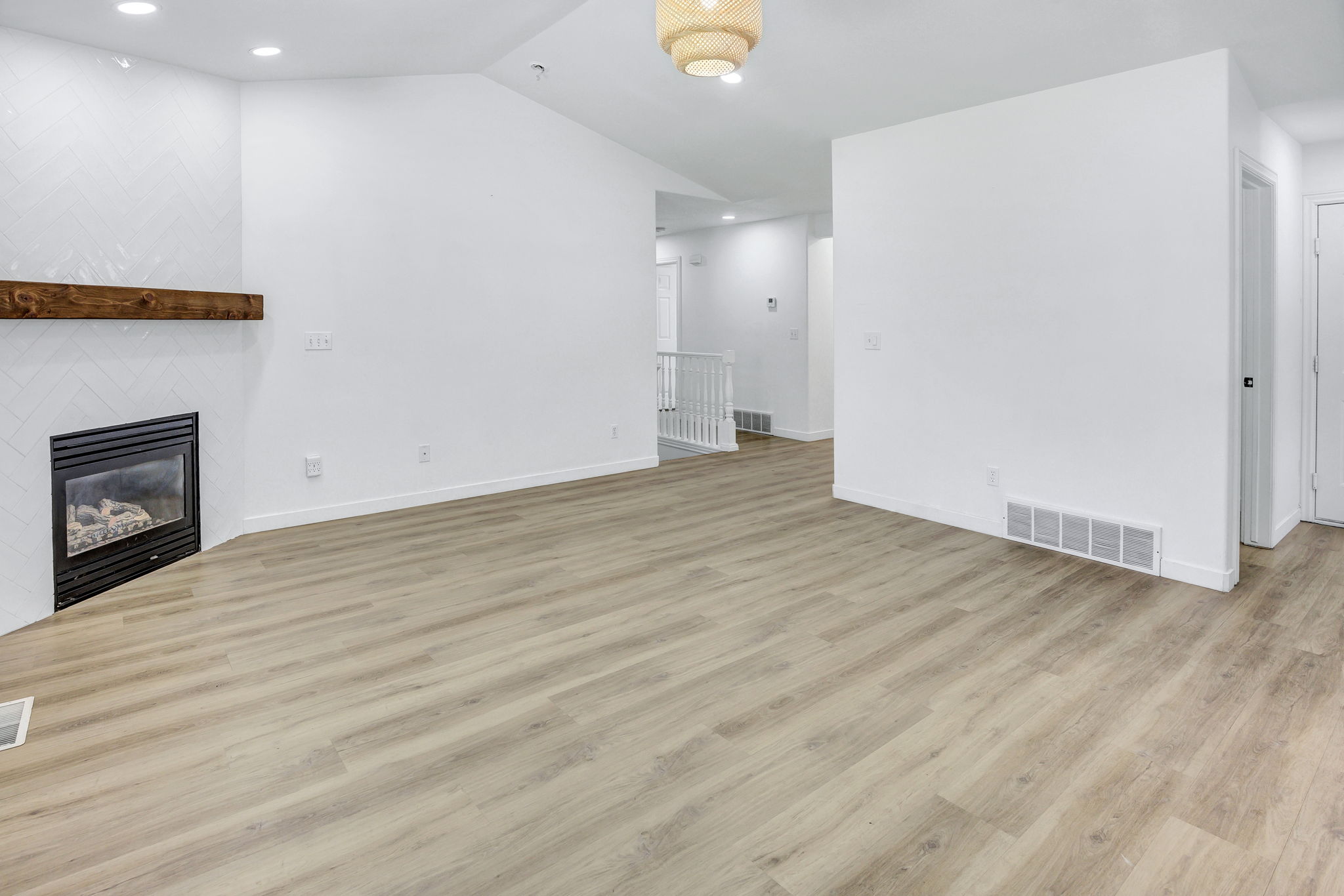 Spacious interior with light wood-finish flooring