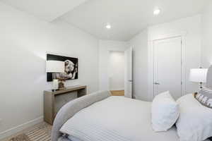 Room featuring recessed ceiling lighting, a contemporary white door with brushed nickel hardware, and a second interior door with brushed nickel hardware